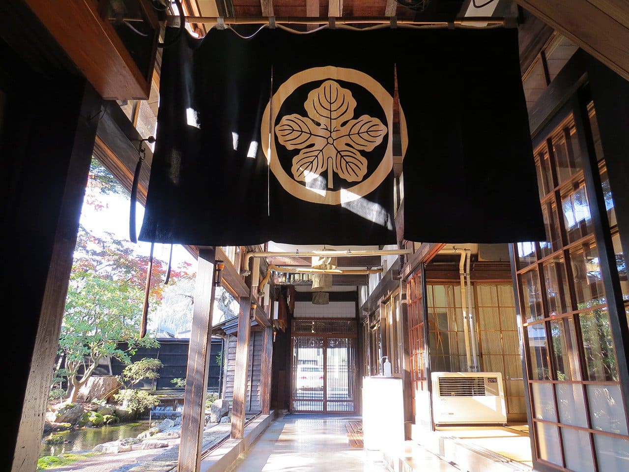 Interior corridor with family-crest noren curtain