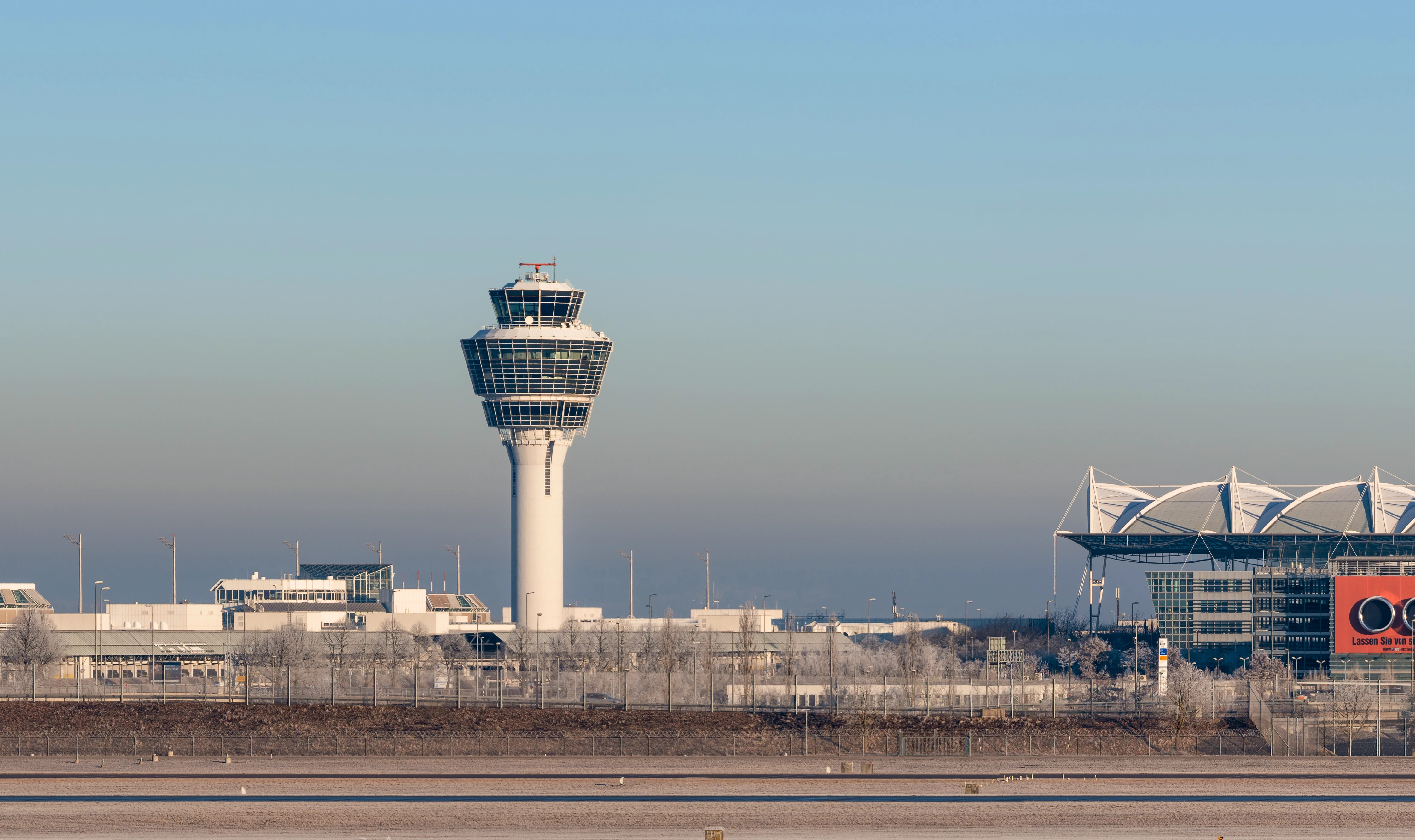 Munich Airport view with control tower and buildings on a clear day
