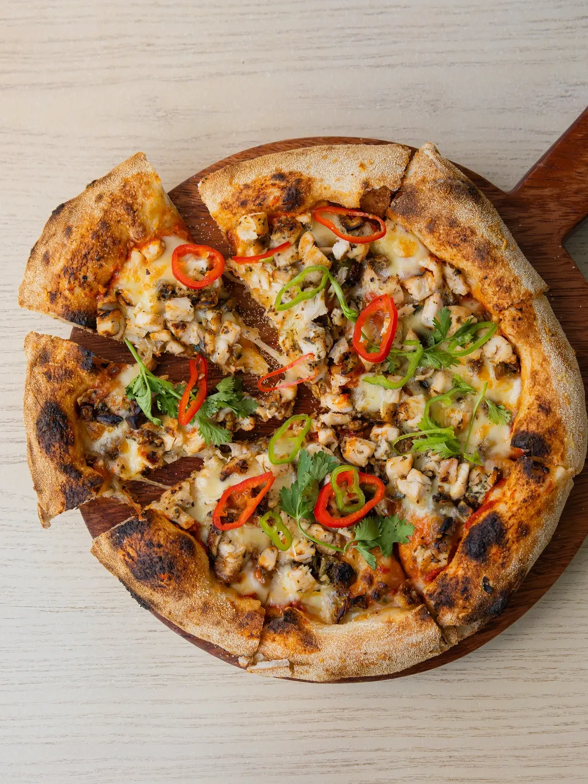 Wood-fired, perfectly crisp, and worth every bite.