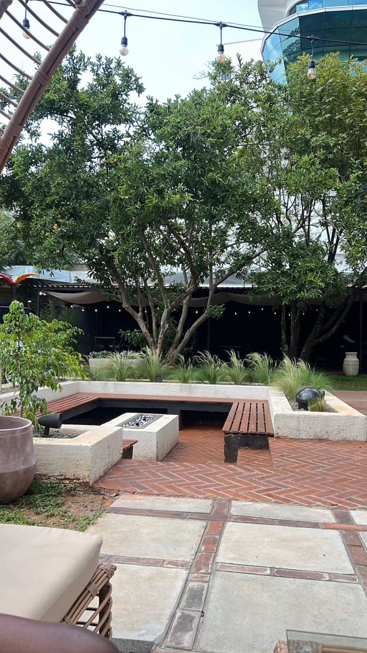 Sip handcrafted cocktails at the outdoor bar, indu
