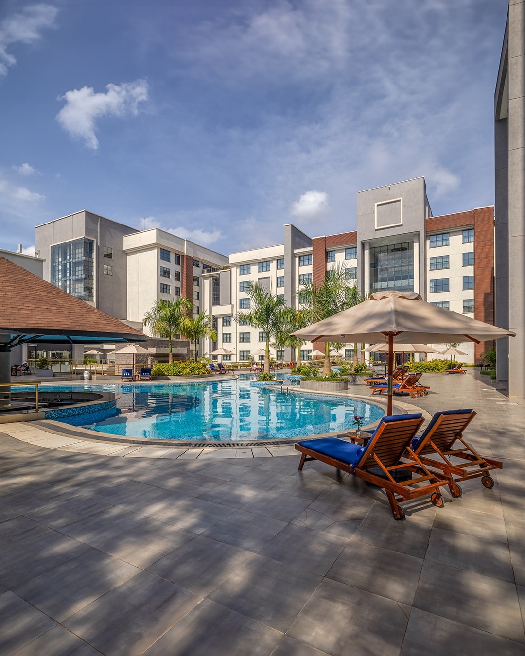 Blue skies, swaying palms, and our sun-kissed pool
