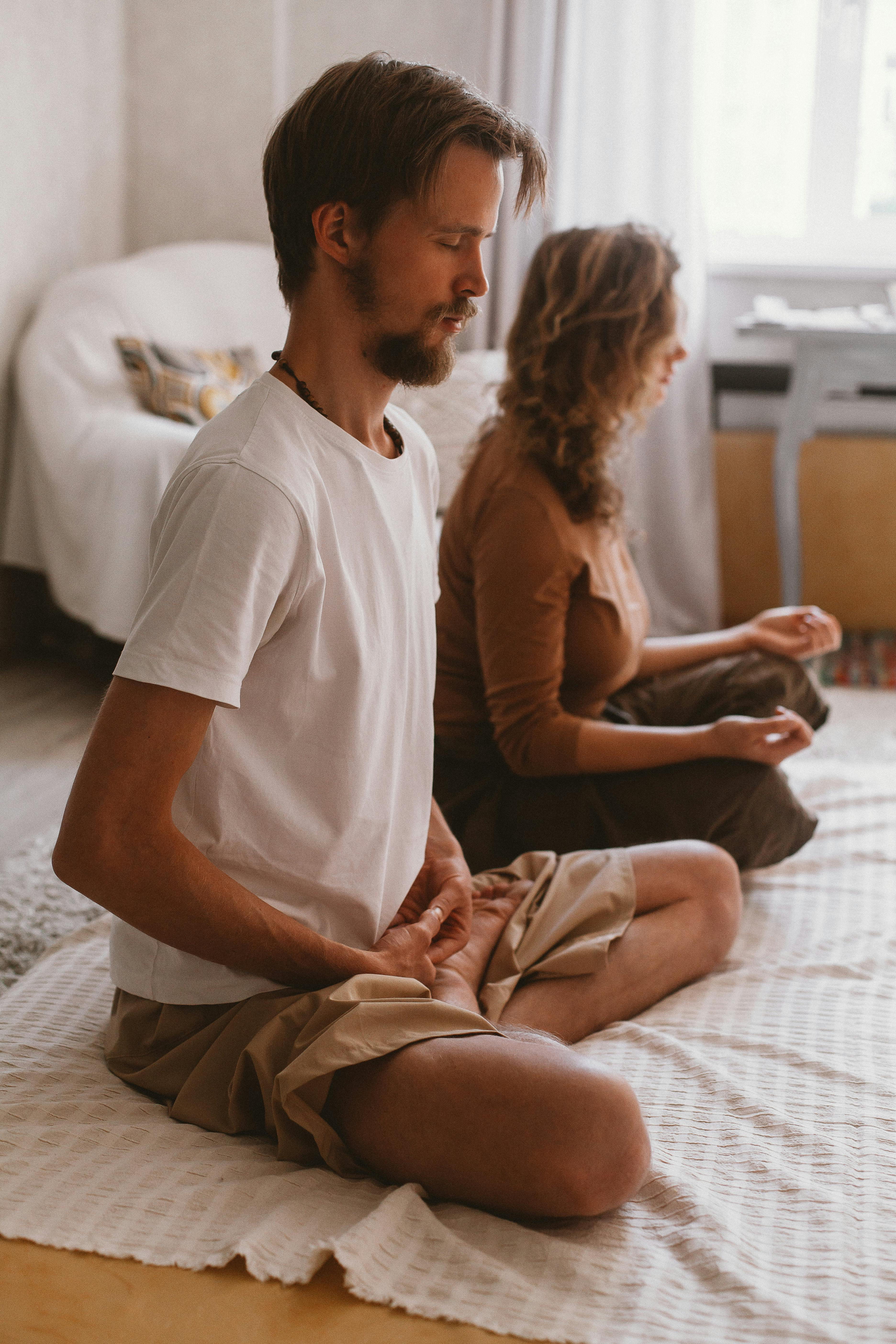 a woman sitting in a yoga pose