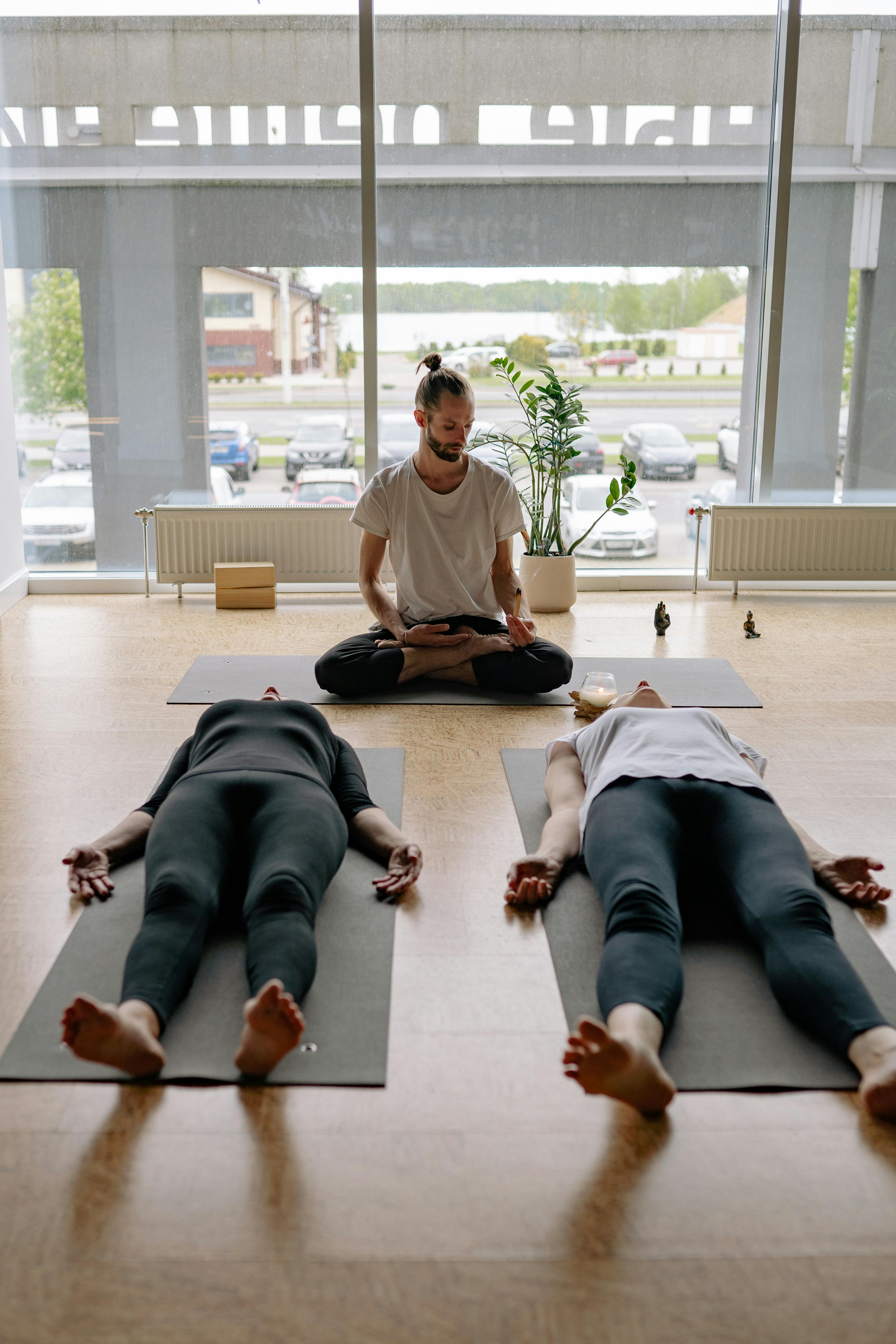 a woman sitting in a yoga pose a woman sitting in a yoga pose