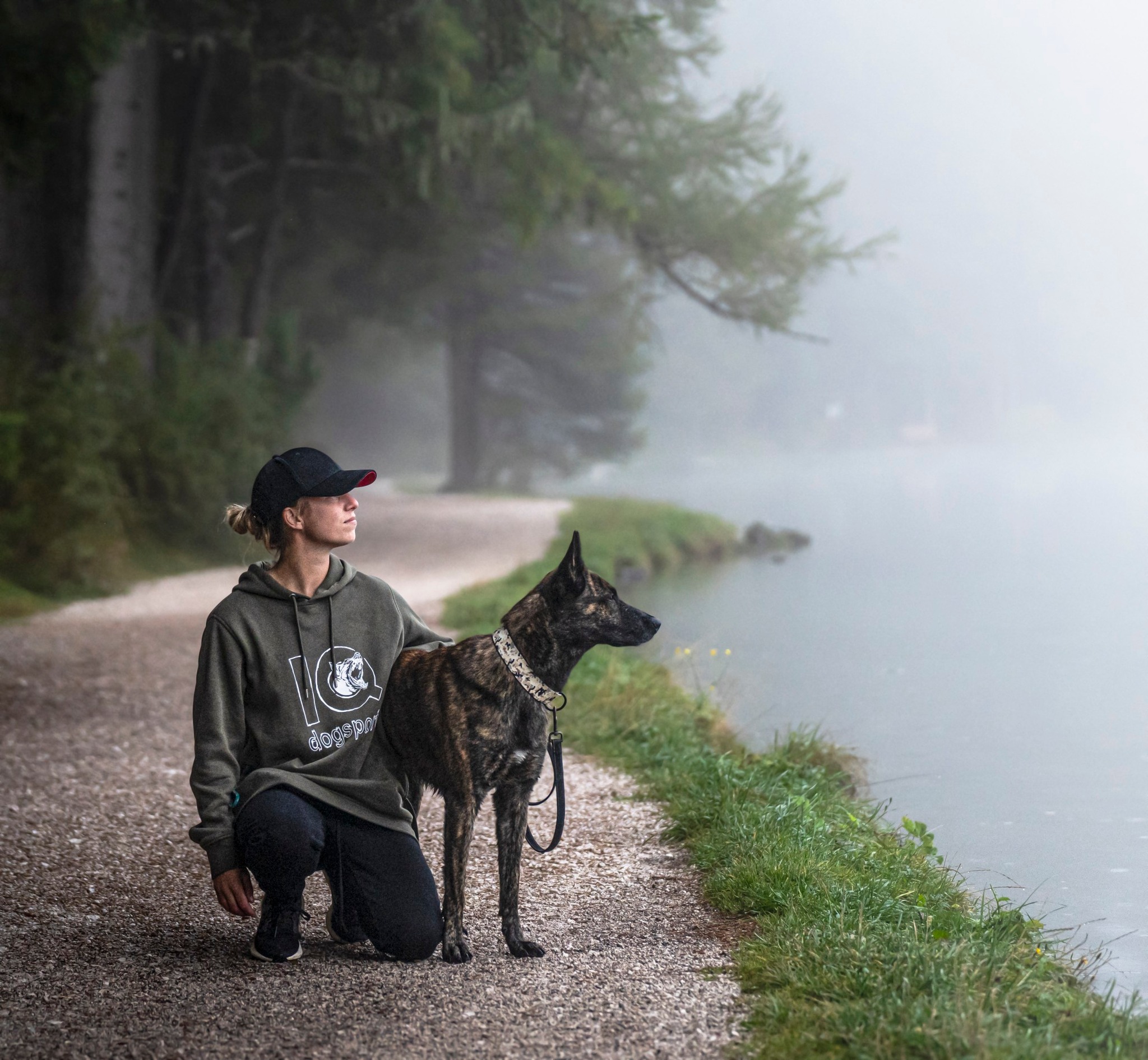 a group of people sitting outside looking at a laptop a group of people sitting outside looking at a laptop