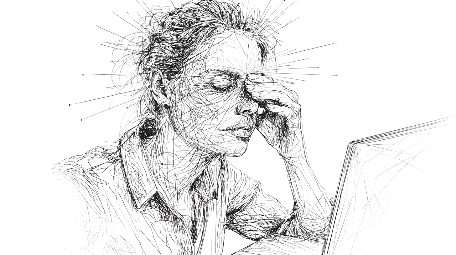 A person rubbing their tired eyes after long hours in front of screen