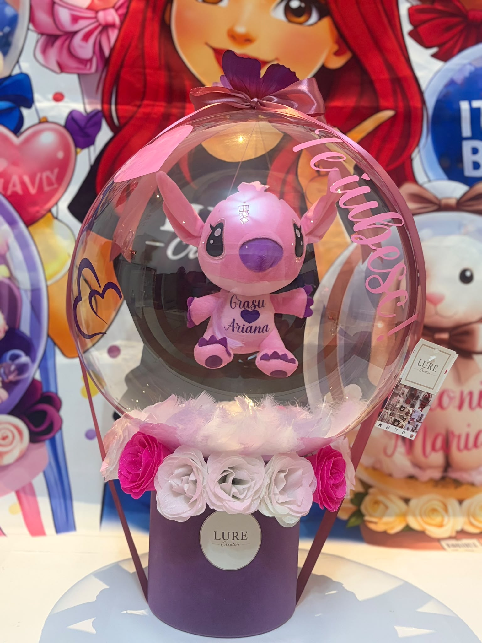BoBo balon transparent cu plus roz in interior si flori la baza