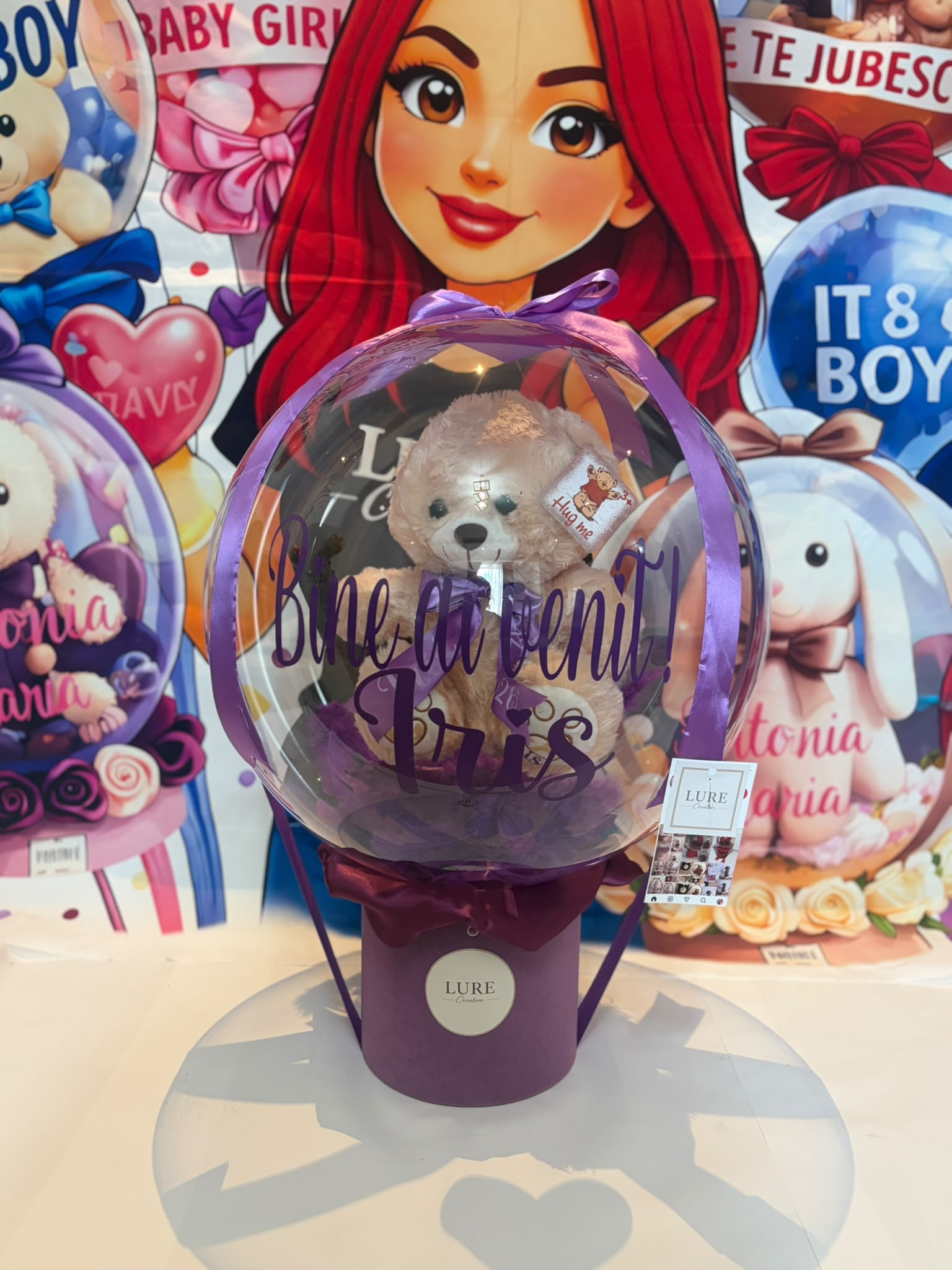 BoBo balon transparent mov cu ursulet de plus in interior si mesaj personalizat Bine ai venit Iris