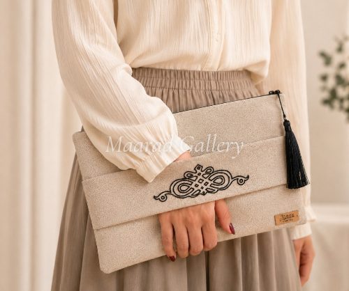 A classy biege  embroidered with black cluch