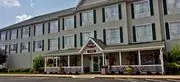 Christopher Inn & Suites logo