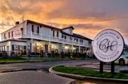 Carriage House Inn logo