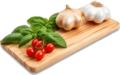 A chopping board with basil, tomatoes, and garlic