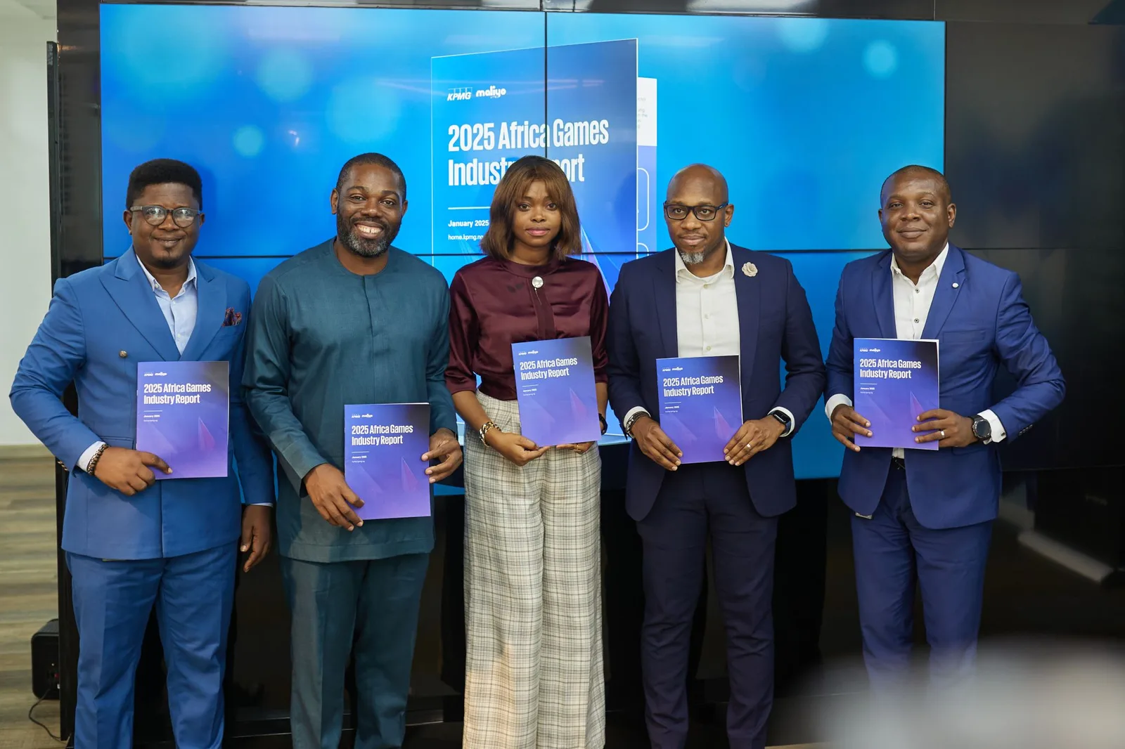 Hugo Obi and KPMG Nigeria Officials holding the 2025 Africa Games Report