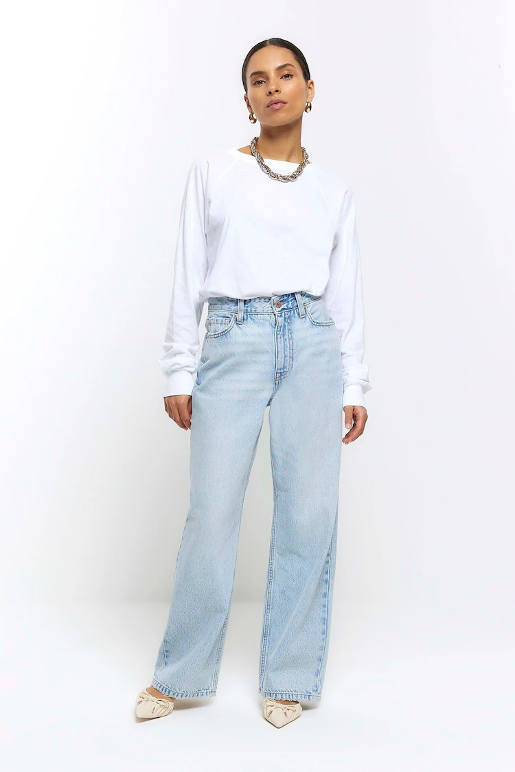 white-long-sleeve-shirt-and-high-rise-blue-jeans