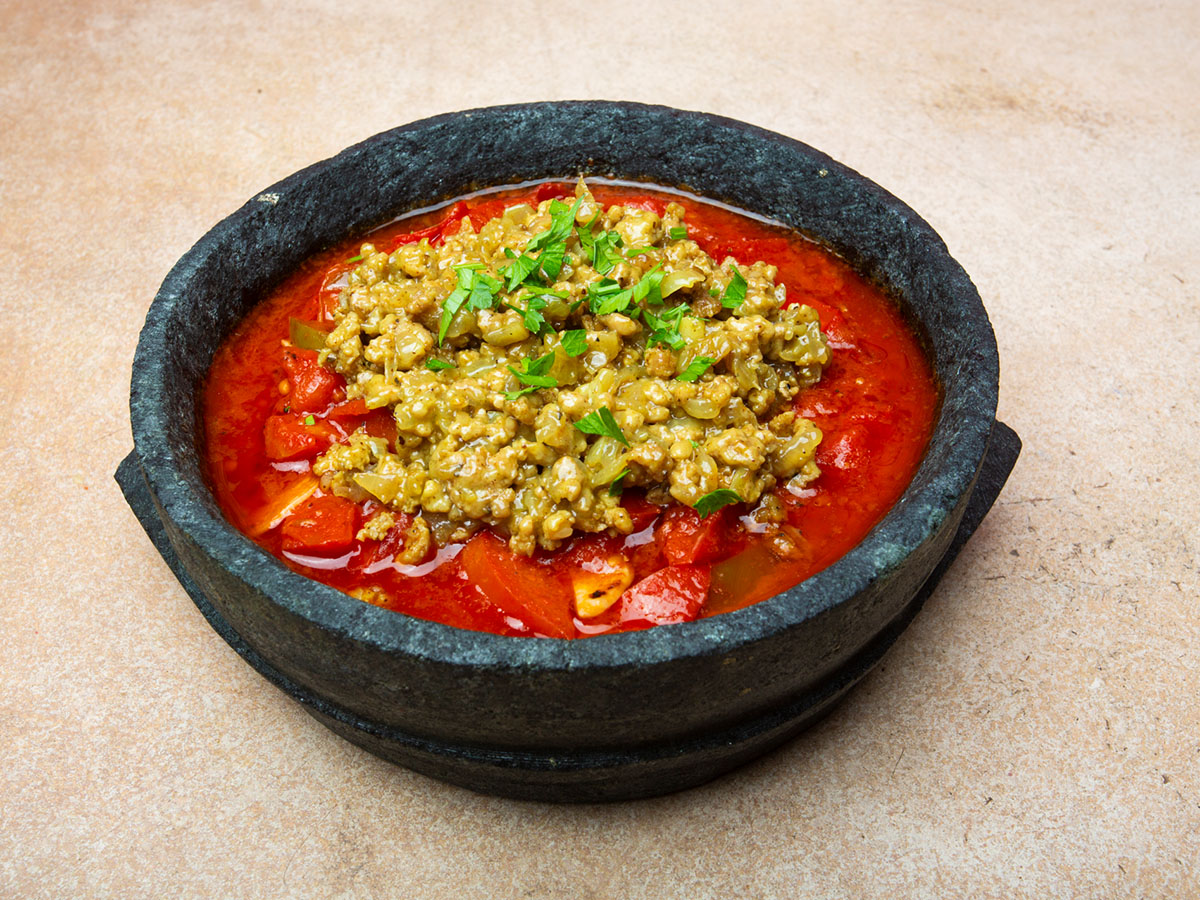 Tomato frying pan with meat Plate