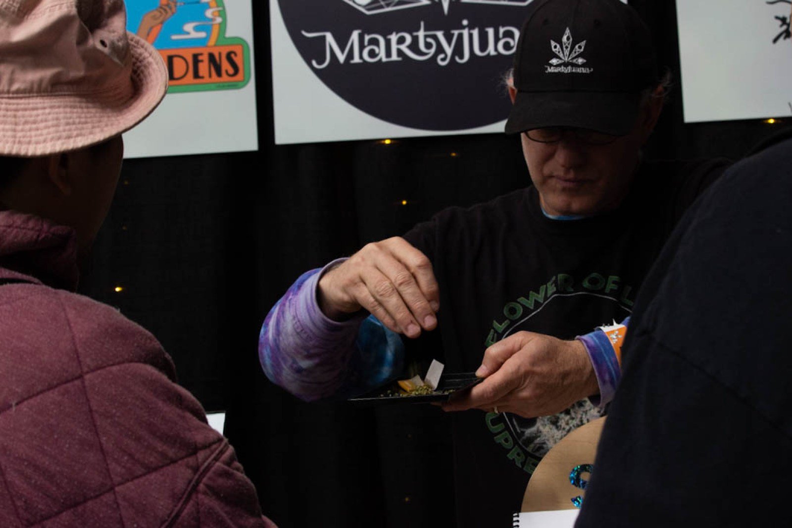 Marty presenting cannabis flower to visitors at The Emerald Cup