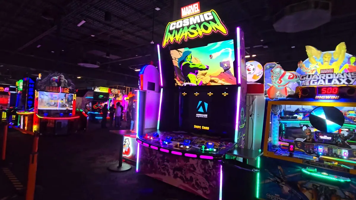 MARVEL Cosmic Invasion cabinet by Adrenaline Amusements next to other Dave & Buster's machines
