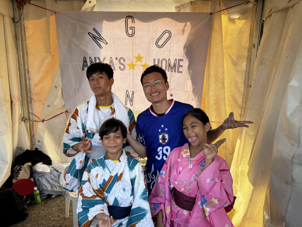 Anya's HOME children with a MATSURI organizer at MATSURI in MANILA 2026