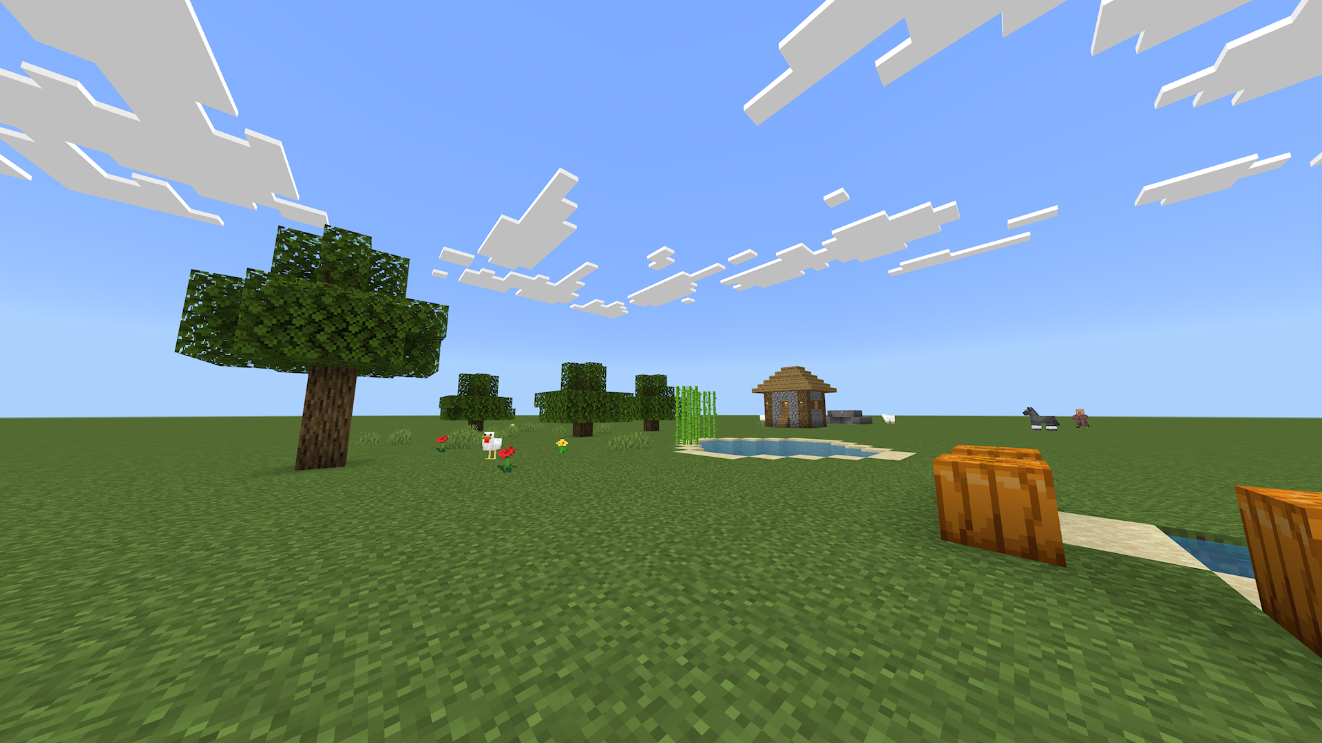 A sunlit village surrounded by a green landscape