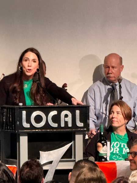 Governor Maura Healey watches State Auditor Diana DiZoglio perform