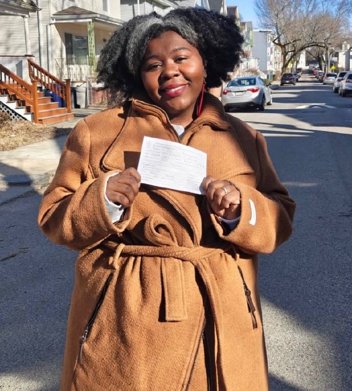 Latoya Gayle holds petition papers