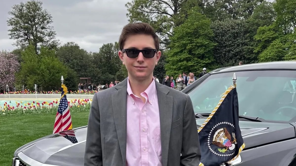 Eric Tarpinian-Jachym standing in front of the presidential motorcade
