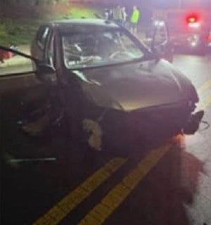 Gray Hyundai Elantra with heavy front-end damage after crashing into a utility pole in Milford
