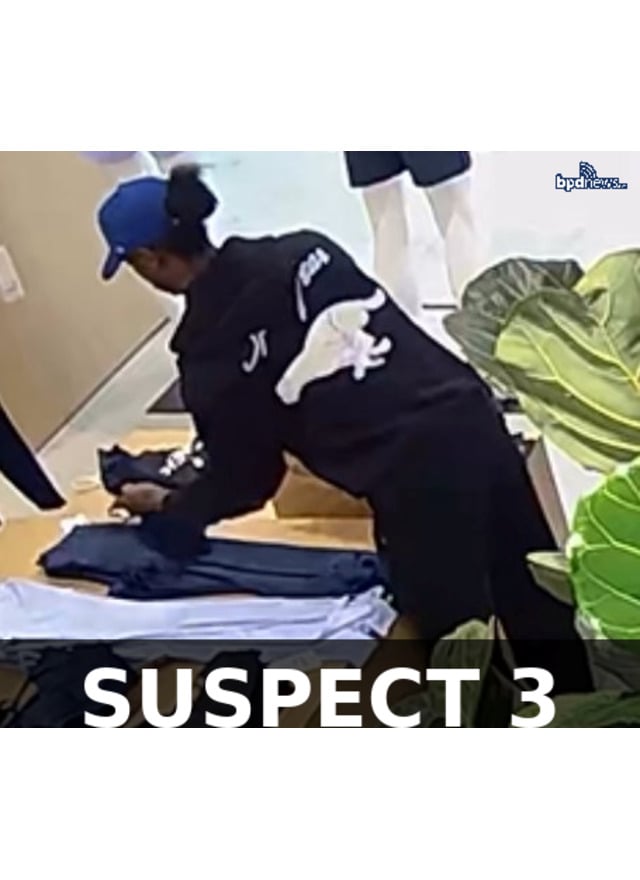 Suspect 3 — bright orange braided hair, prescription glasses