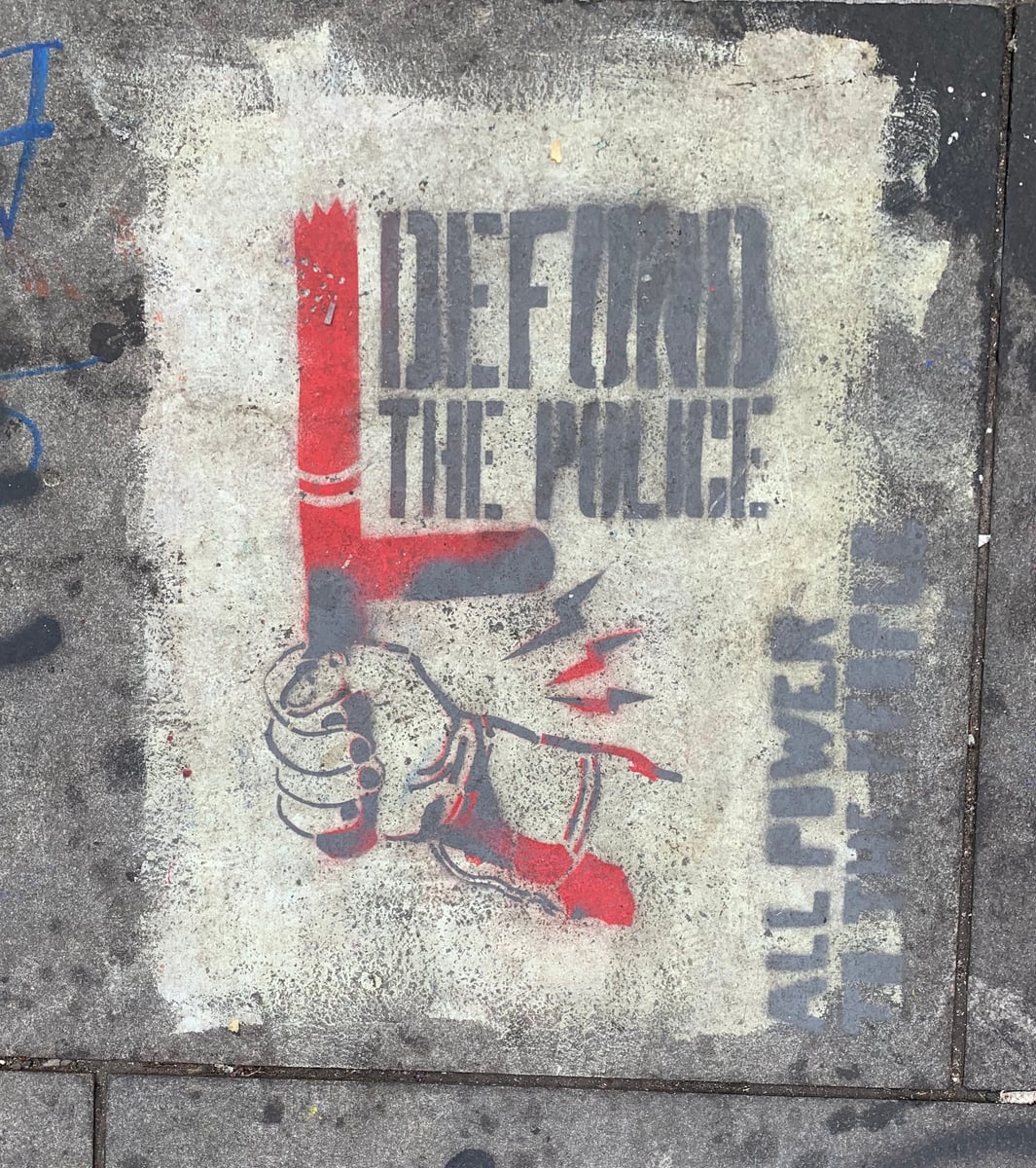 A 'DEFUND THE POLICE' protest sign at a 2020 George Floyd demonstration in New York City