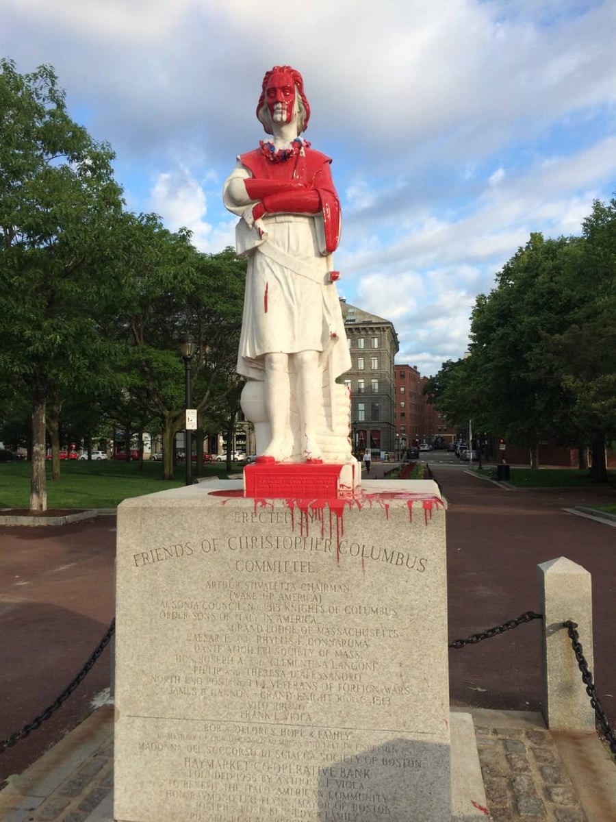 The Christopher Columbus statue at Christopher Columbus Waterfront Park, doused in red paint by protesters during the George Floyd protests in June 2020.