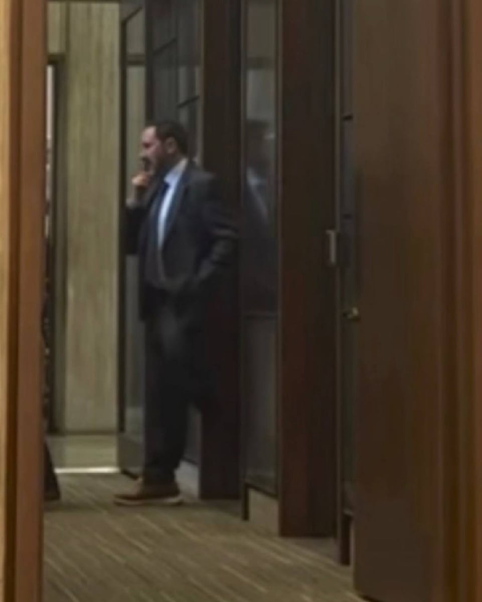 Ben Weber leaving the alleged closed-door meeting in a corridor off the Boston City Council floor during the June 10 budget vote.