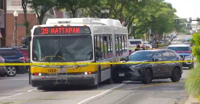 Stolen SUV stopped against Route 28 MBTA bus 1222 on Blue Hill Avenue.