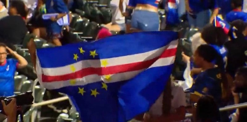Cape Verde fans wave the national flag during a watch party for the World Cup qualifier.