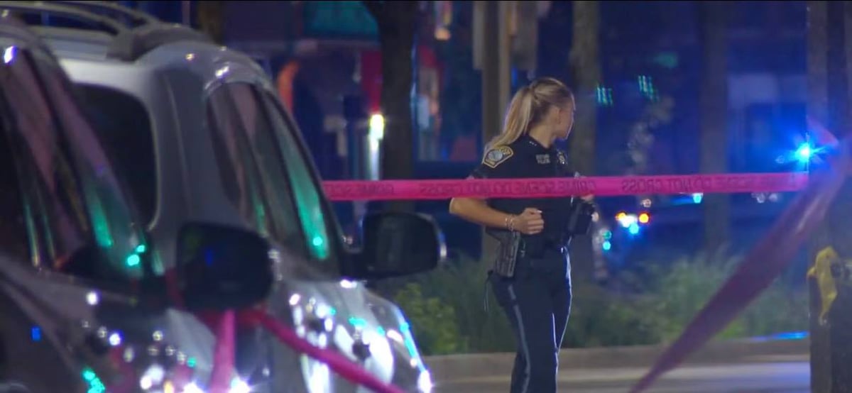 Boston Police officer at one of the Sunday overnight shooting scenes