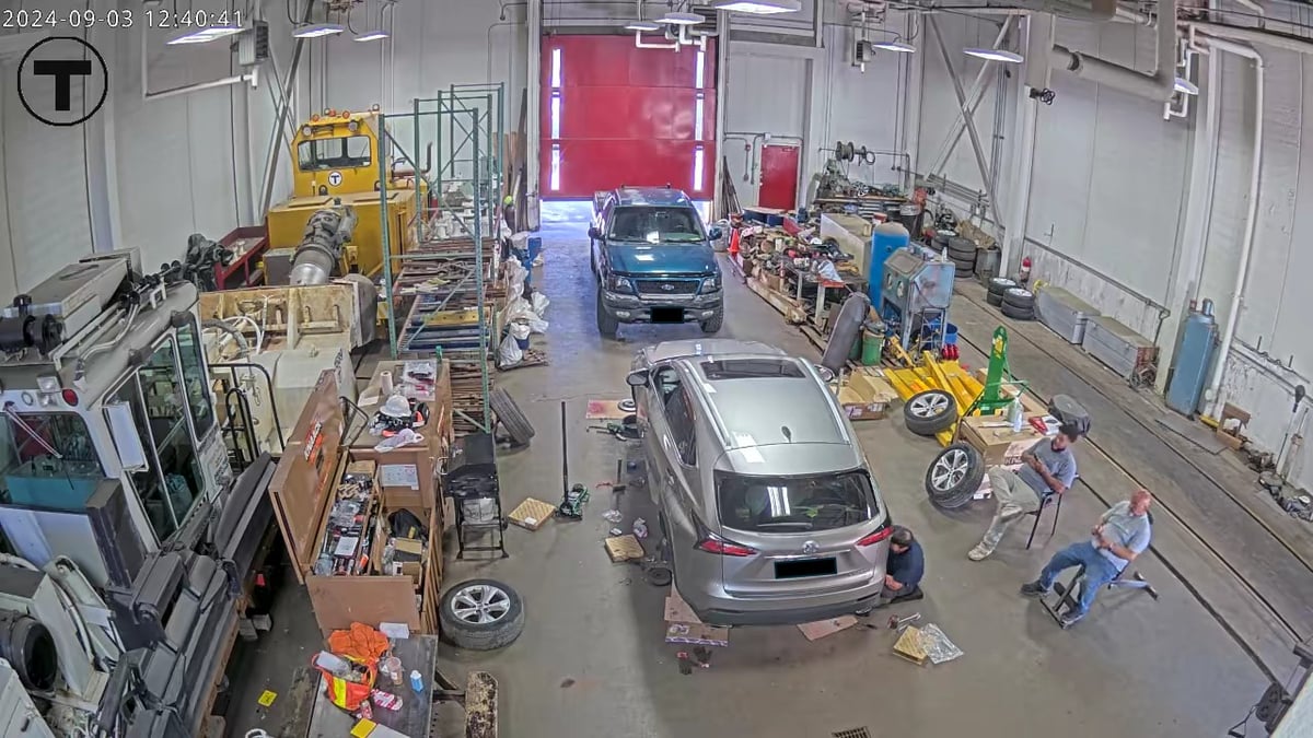 Surveillance image of car being serviced in the MBTA Cabot Yard garage