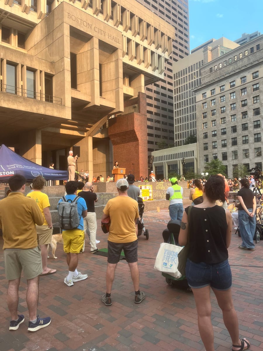 Cyclists at Louisa Gag vigil listening to Mayor Wu at City Hall.