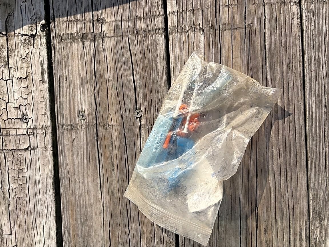 Syringes bagged by a resident on the Fort Point pier.