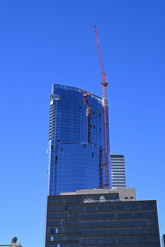 A crane at work in Boston during the city’s construction boom — before housing approvals plunged to a 13-year low.