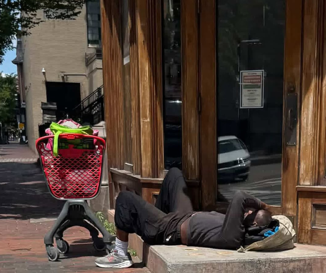 Passed out at the front door: A man lies unconscious outside a family restaurant in Boston’s South End — while Councilor Sharon Durkan blocks a resolution to declare a public emergency. / Instagram @southendsos