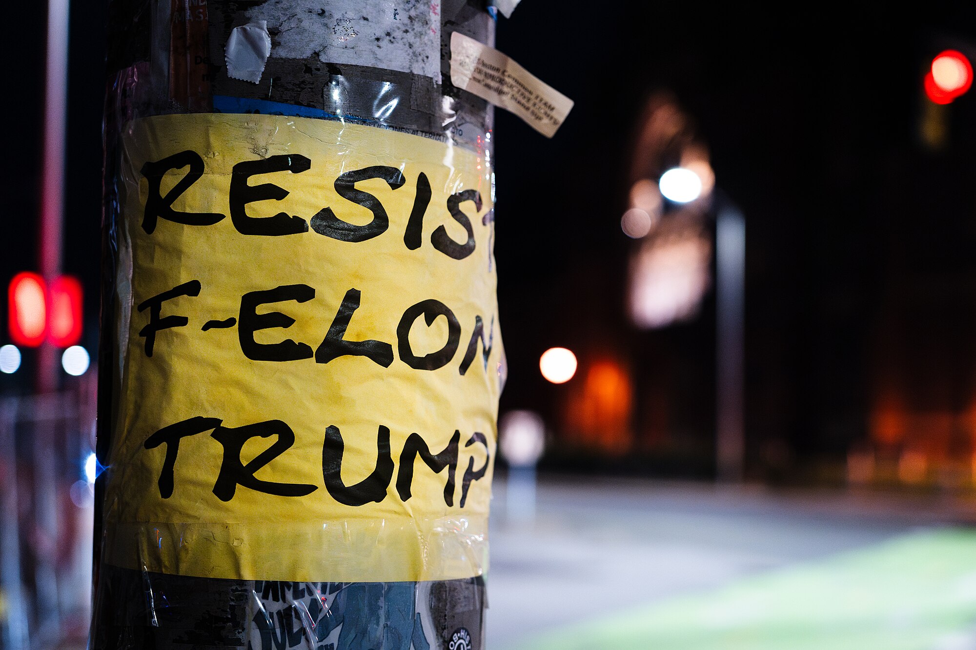 Posters like this popped up near Harvard Square as Trump’s crackdown forced the Ivy League to dismantle its DEI empire.
