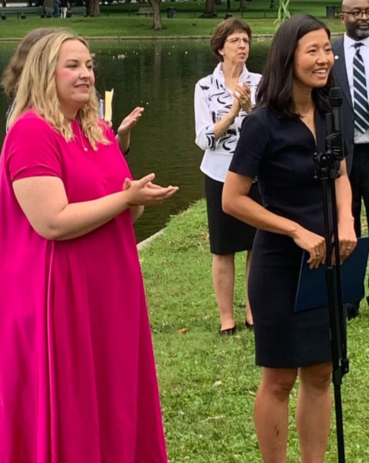 Durkan pictured in a billowing hot-pink dress alongside Mayor Michelle Wu — a very different look from the sharper photo ops now sparking speculation at City Hall.