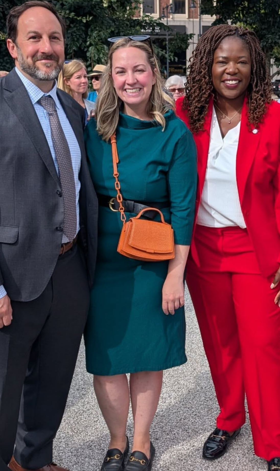 Durkan beams in teal alongside Ben Weber and Ruthzee Louijeune — her sharper style only fueling speculation at City Hall.