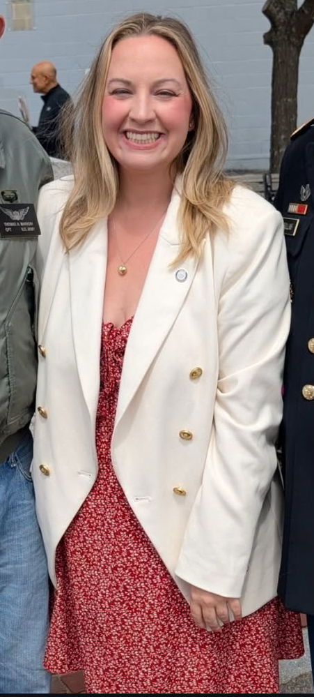 Durkan beams in a white blazer and floral dress — the polished new look that’s fueled whispers across City Hall.