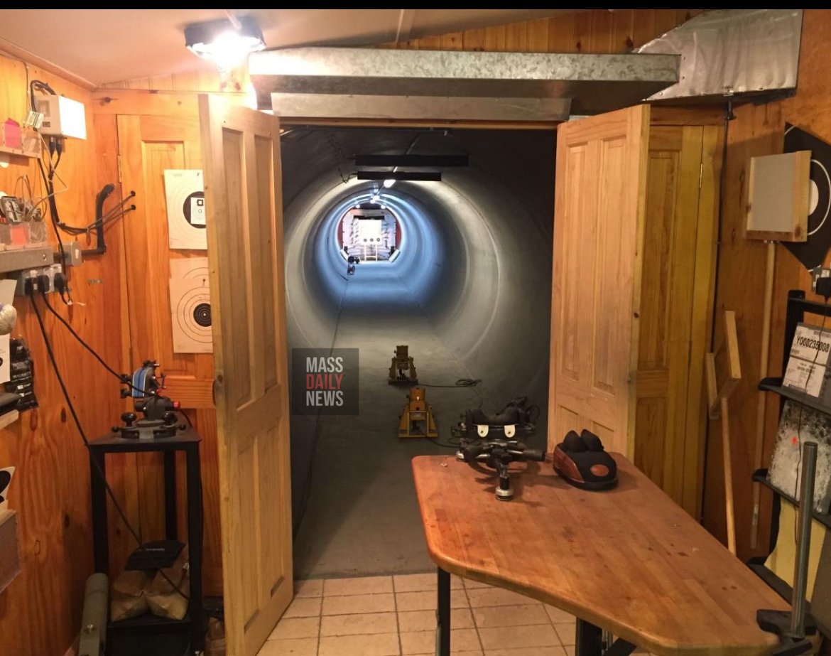 Leaked photo appears to show a concrete-walled firing lane stretching through the basement of Fire Lt. Joshua Thompson’s Milton home, complete with mounted targets.