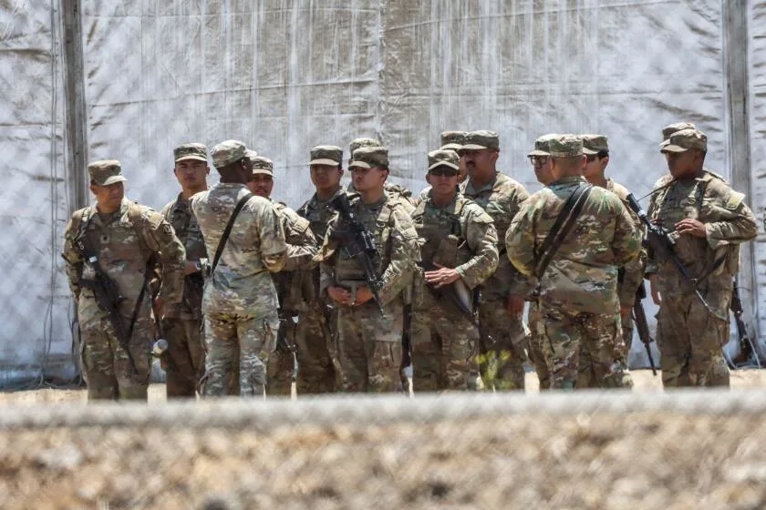 National Guard soldiers assemble in formation as Wu warns Boston could be next. (Robert Gauthier / Los Angeles Times)