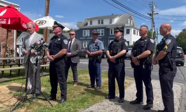 Police brass and prosecutors brief reporters after the daylight murder in Shrewsbury. Credit: Worcester County District Attorney’s Office.