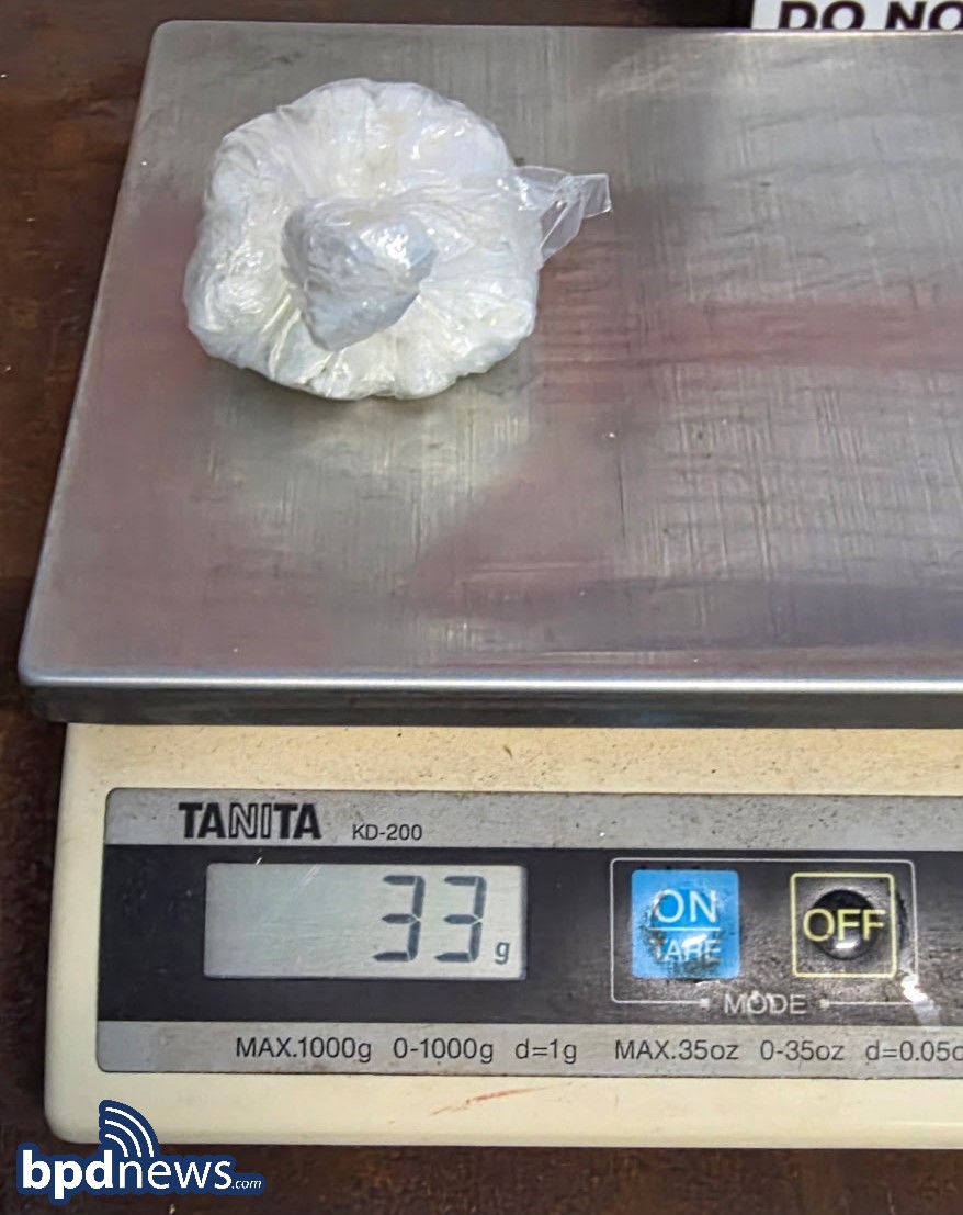 Police say this taped bag, weighing 33 grams, was concealed on the suspect’s body and burst open during a Boston jailhouse search, revealing 31 crack-filled baggies.