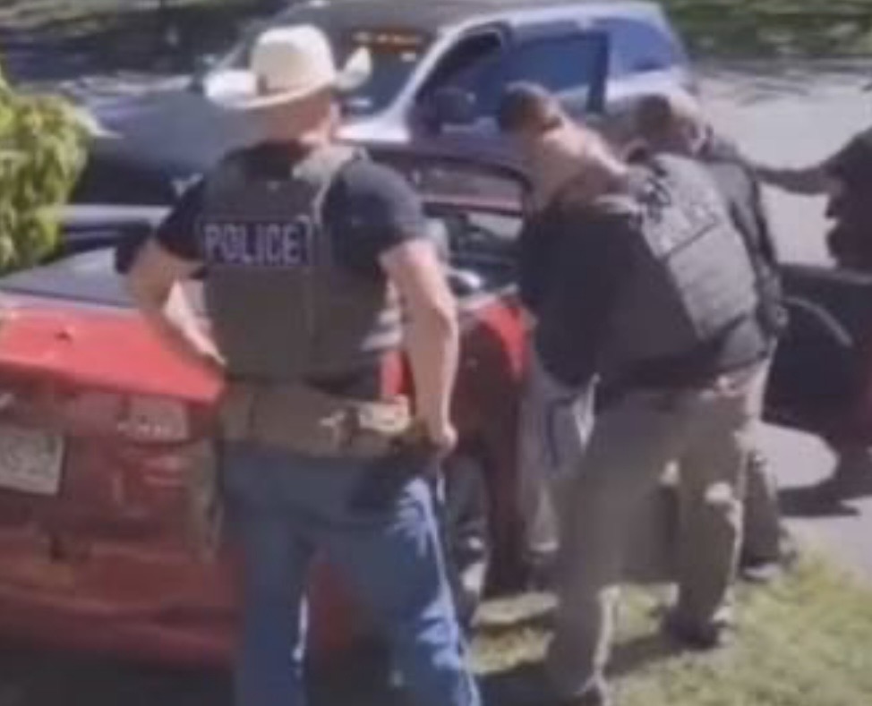 ICE agents swarm a red sedan in Leominster, Massachusetts — the dramatic raid where officials say a father bolted inside and left his 5-year-old autistic daughter behind.
