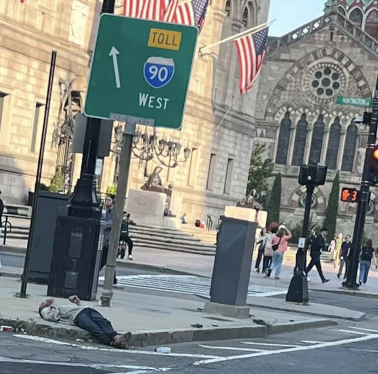 Collapse on Copley: an addict sprawls out on the sidewalk in Boston’s Back Bay — one of the city’s wealthiest neighborhoods — as Mayor Wu dismisses crime and drug fears as a mere ‘narrative.’ (Credit: southendsos/Instagram)