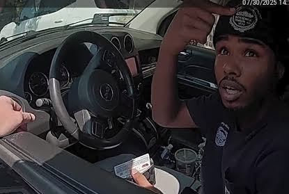 Dashcam footage shows the moment a Massachusetts State Trooper dives into Nasiru Ibrahim’s moving car during a chaotic South Boston traffic stop on July 30.