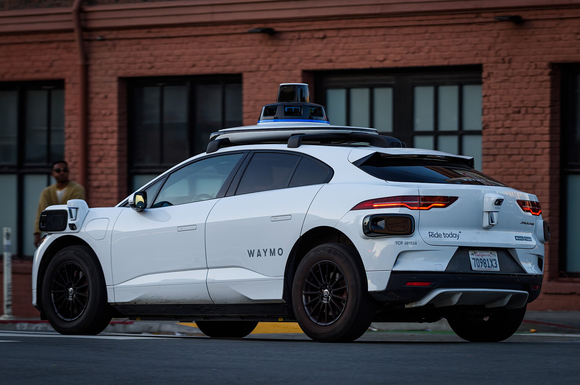 Waymo cars glide through city streets elsewhere while Boston holds hearings about the future.